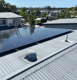 Rooftop solar panels installed on metal roof in commercial area